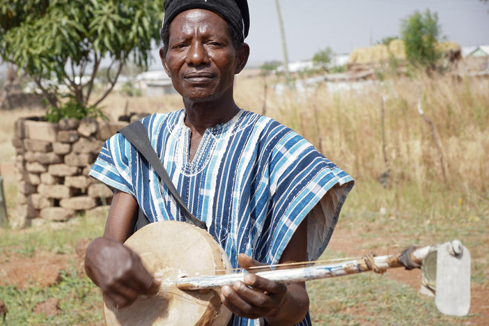 "Small," as he was widely known, played a homemade <em>kologo </em>(a 2-string lute)— with dog tags attached to the end for rattles.