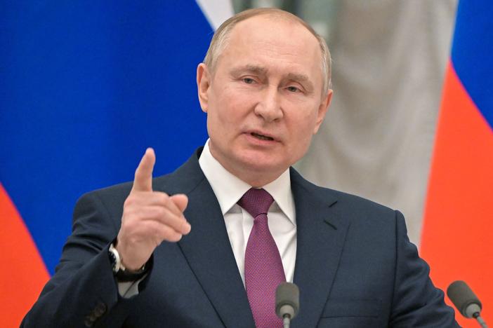 Russian President Vladimir Putin speaks during a joint news conference with Germany's chancellor following their meeting at the Kremlin, in Moscow, on Tuesday. That day the Kremlin said it pulled back some Russian troops but the U.S. and NATO have rejected the claim.