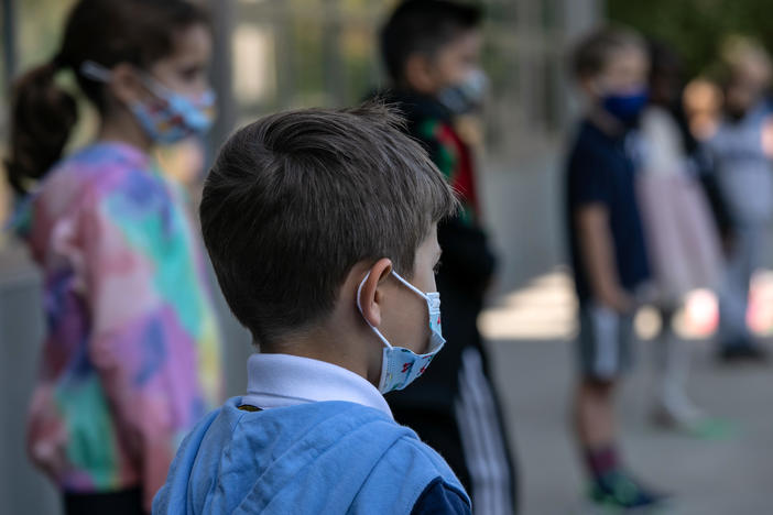 The White House says it is planning to distribute masks for children. The announcement comes as many states have been dropping mask requirements for schoolchildren.
