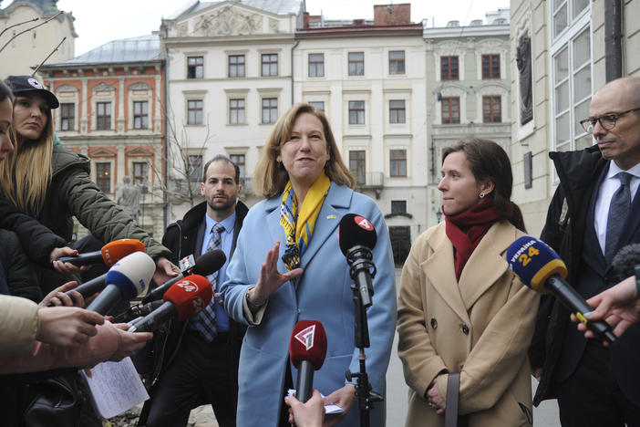 The acting U.S. ambassador to Ukraine, Kristina Kvien, speaks to media in Lviv, Ukraine, on Tuesday. The U.S. has relocated the embassy from the capital Kyiv to the western city of Lviv, citing the buildup of Russian forces on Ukraine's borders. An estimated 20,000 or more Americans have been living in Ukraine. Many have left, but some say they'll remain even if war breaks out.