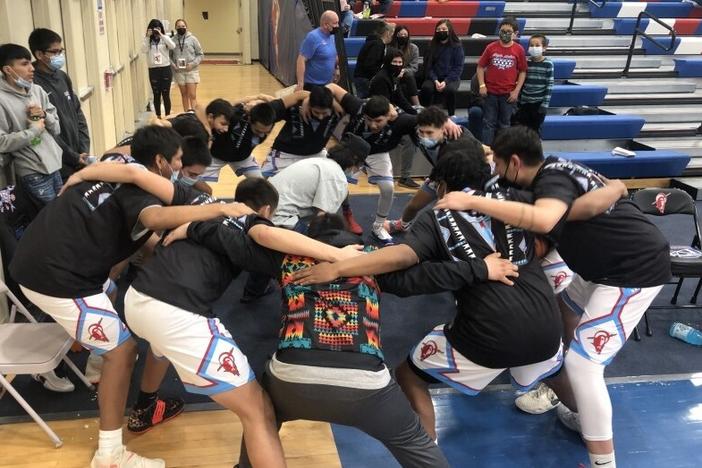 Wyoming Indian Boys basketball team huddle up before heading out to face the Greybull Buffalo.