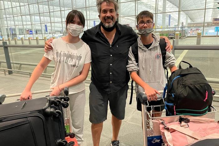 Kevin Tranbarger poses with his two children outside the Hong Kong International Airport in July, before they left for the United States. A few weeks later, Tranbarger decided to permanently move away from Hong after living there for nearly three decades.
