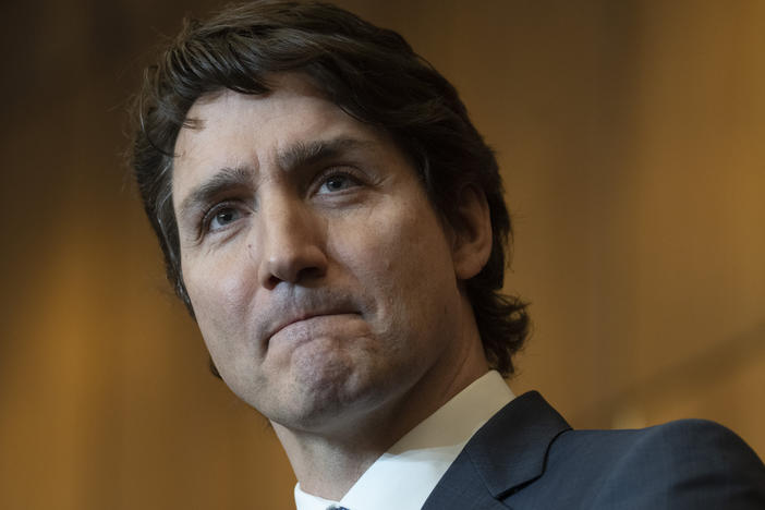 Prime Minister Justin Trudeau listens to a question during a news conference on Monday in Ottawa. Trudeau said emergency powers are still needed despite police ending border blockades and the occupation of the nation's capital by truckers and others angry over Canada's COVID-19 restrictions.