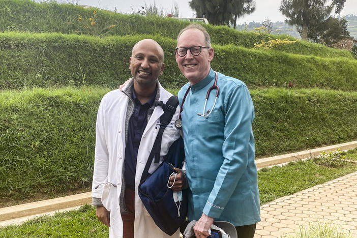 Dr. Paul Farmer (right) and Dr. Sriram Shamasunder on the Butaro hospital campus in Rwanda on Feb. 17. Farmer died on Feb. 21.