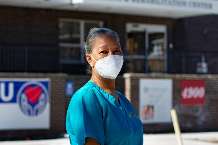 Nurse's aide Patricia Johnson has worked for the Ambassador Nursing and Rehabilitation Center on the north side of Chicago for nearly 24 years. The pandemic has been grueling on her and her colleagues. "The hardest part is watching people die alone without their families," says Johnson, who now sometimes works double shifts due to staff shortages.
