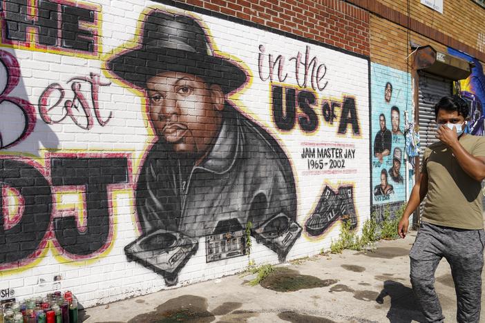 A pedestrian passes a mural of rap pioneer Jam Master Jay of Run-DMC in 2020 in Queens. A man charged in the slaying of Run-DMC legend once filmed a brazen rap video in front of the mural, prosecutors say in court papers opposing the defendant's release on bail.