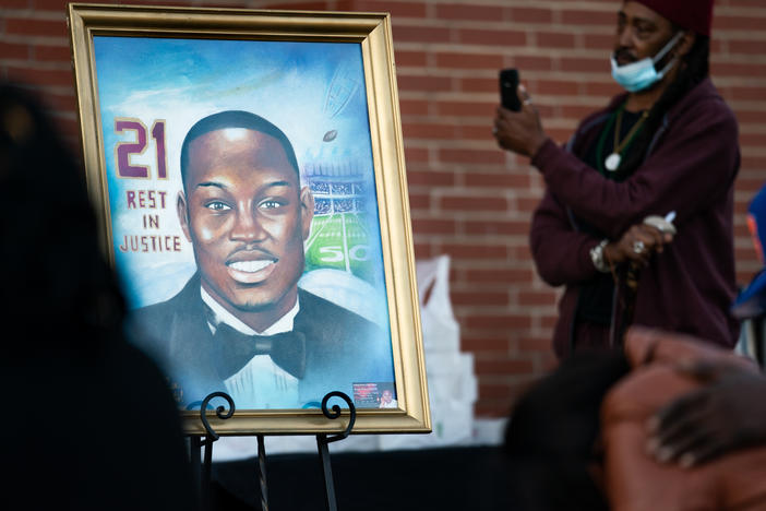 A painting of Ahmaud Arbery is displayed during a vigil at New Springfield Baptist Church on Wednesday in Waynesboro, Ga.