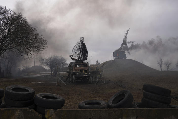 Smoke rises from an air defense base in the aftermath of an apparent Russian strike in Mariupol, Ukraine, on Thursday.