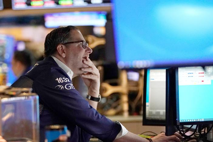 Traders work on the floor of the New York Stock Exchange at the opening bell on Tuesday in New York. Stocks tumbled on Thursday after Russia invaded Ukraine, sending the Nasdaq into what's known as a bear market.