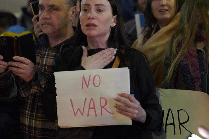 People protest the Russian invasion of Ukraine at a demonstration in the Studio City neighborhood of Los Angeles on Thursday.