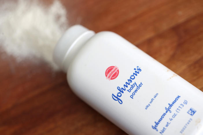 Johnson & Johnson's baby powder is displayed on a table in this photo illustration. A federal judge has allowed Johnson & Johnson's spinoff of a unit to proceed with a controversial bankruptcy.