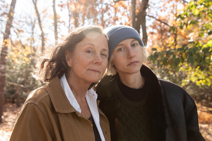 Hope Schiller Wilt (left) and her daughter, Hanna Wilt, outside her home on Nov. 19, 2021, in Manasquan, N.J. The family plans to continue her lawsuit. "It's what she wanted," her mother said.