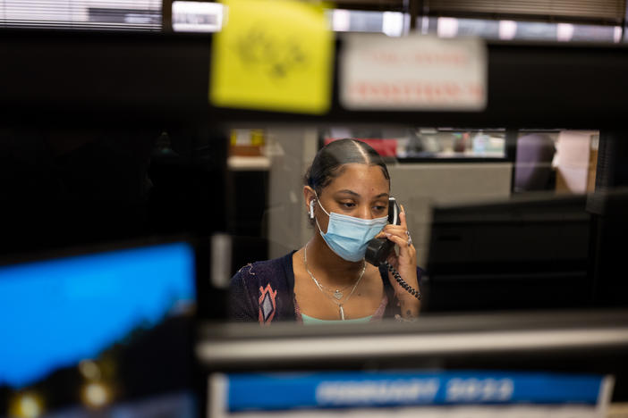 Destiny Laurence receives a call at the Harris County Election Office in downtown Houston. In January alone, Laurence and the 14 other workers in the call center received 8,000 calls from people asking for help navigating the voting process.