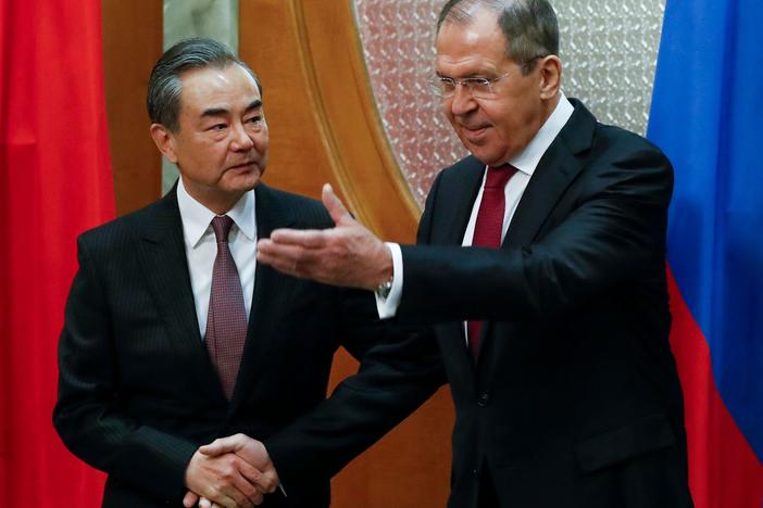 China's foreign minister, Wang Yi, stressed to his Russian counterpart, Sergey Lavrov, that China wanted "dialogue and negotiation," rather than military means, to solve tensions.