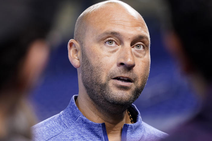 Derek Jeter, CEO of the Miami Marlins, speaks with the news media before a baseball game against the Philadelphia Phillies last year in Miami. Jeter announced a surprise departure from the Miami Marlins on Monday.