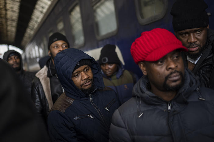 African residents in Ukraine wait at the platform inside the Lviv railway station on Sunday in Lviv in western Ukraine.