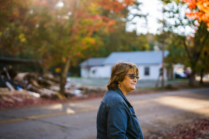 Gretchen Turner looks toward her home before making her way to Halloween festivities in downtown Waverly, Tenn.