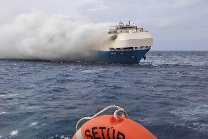 Smoke billows from the burning Felicity Ace car-transport ship as seen from a Portuguese navy vessel southeast of the mid-Atlantic Portuguese Azores islands. The large cargo vessel carrying cars from Germany to the U.S. sank in the mid-Atlantic 13 days after a fire broke out on board.