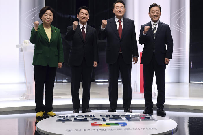 South Korea's leading presidential candidates (from left): Sim Sang-jung of the opposition Justice Party, Ahn Cheol-soo of the opposition People's Party, Yoon Suk Yeol of the main opposition People Power Party and Lee Jae-myung of the governing Democratic Party pose for a photo before a televised debate for the March 9 presidential election, in Seoul, Feb. 25.