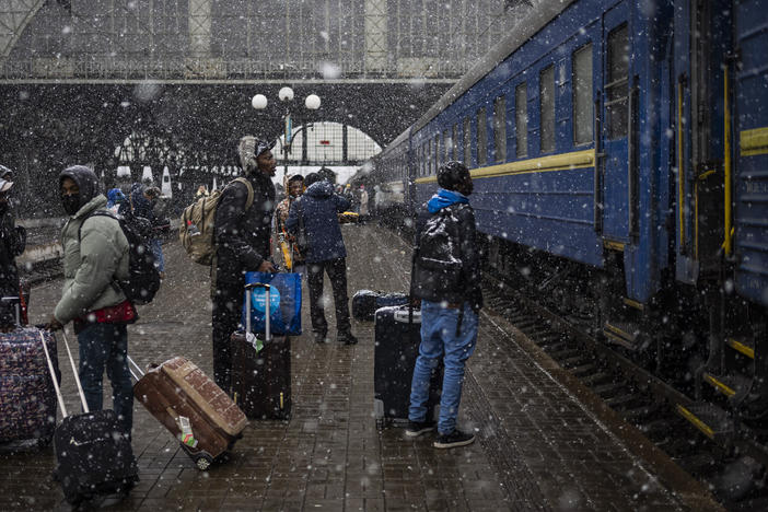 Nigerian students in Ukraine wait at the platform at the Lviv railway station on Sunday.