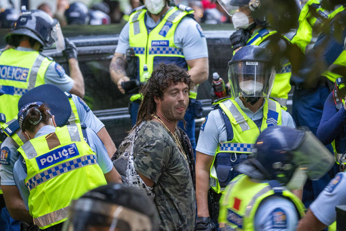 A demonstrator is arrested at a protest opposing coronavirus vaccine mandates in Wellington, New Zealand, on Wednesday.