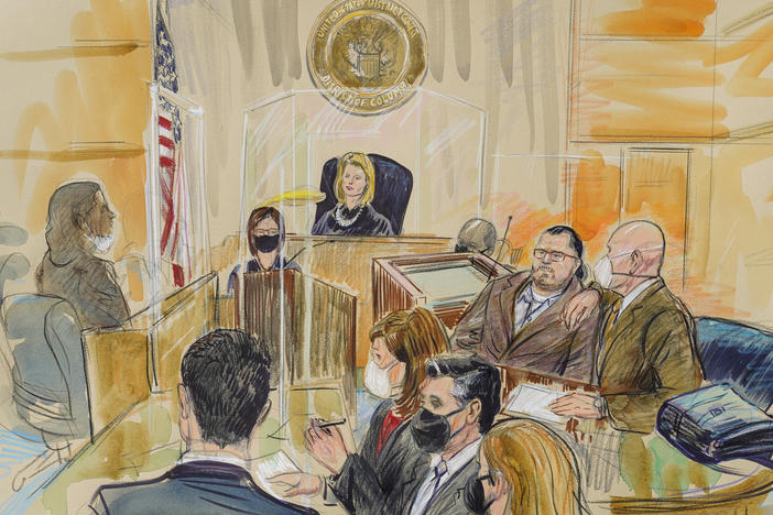 This artist sketch depicts Judge Dabney Friedrich looking out from the bench during proceedings in the trial against Guy Wesley Reffitt, joined by his lawyer William Welch, top right, in federal court in Washington.