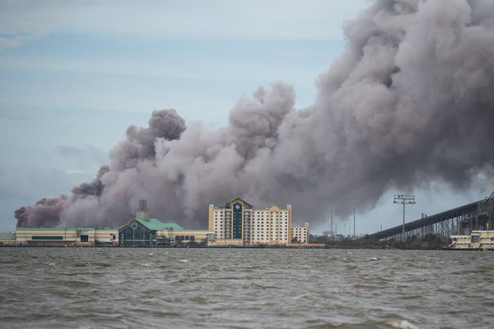 A chemical plant near Lake Charles, La., burns after sustaining damage from Hurricane Laura in August 2020. A new analysis finds about one third of hazardous chemical facilities in the United States are at risk from climate-driven extreme weather.