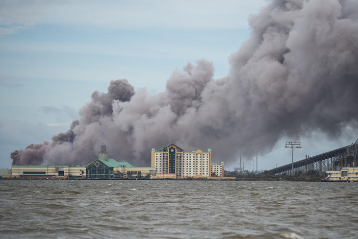 A chemical plant near Lake Charles, La., burns after sustaining damage from Hurricane Laura in August 2020. A new analysis finds about one third of hazardous chemical facilities in the United States are at risk from climate-driven extreme weather.
