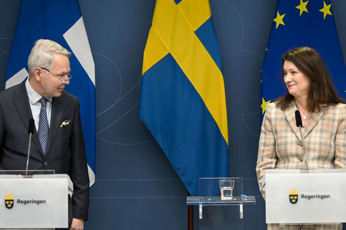 Finnish Foreign Minister Pekka Haavisto, left, and his Swedish counterpart Ann Linde, take part in a joint news conference in Stockholm on Feb. 2, 2022, after talks on European security.