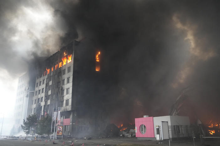 A building burns after shelling in Kyiv, Ukraine, on March 3. Russian forces have escalated their attacks on crowded cities in what Ukraine's leader called a blatant campaign of terror.