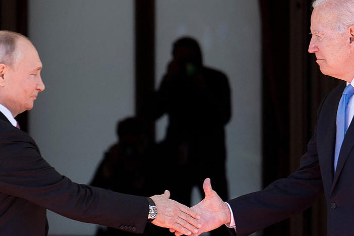 Russian President Vladimir Putin shakes hands with President Biden prior to a U.S.-Russia summit in Geneva in June.