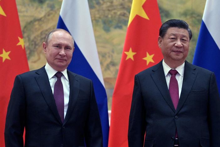 Russian President Vladimir Putin and Chinese President Xi Jinping pose during their meeting in Beijing on Feb. 4.