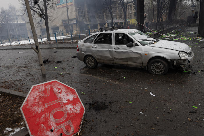 Rubble and a damaged vehicle is seen across the street from the Kyiv TV Tower on Wednesday.