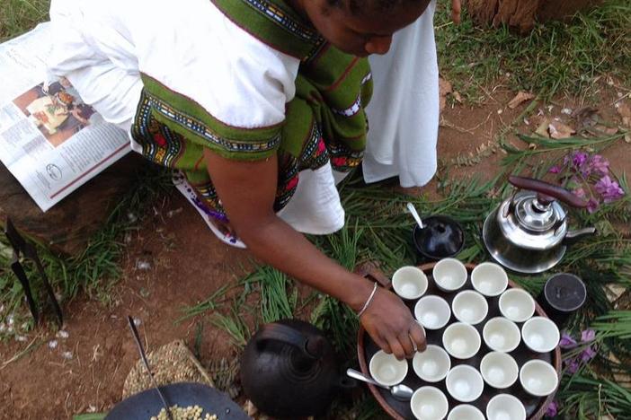 A coffee grower in Ethiopia performs a traditional coffee ceremony.