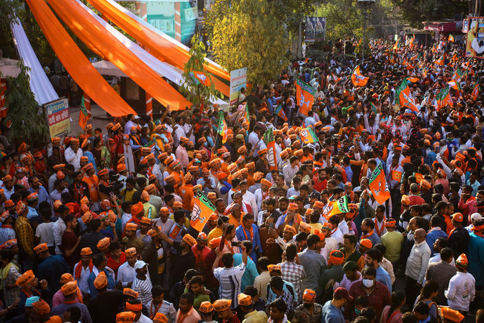 Crowds turn out to cheer India's Prime Minister Narendra Modi during a road show in support of Uttar Pradesh state elections on Friday in Varanasi, India.