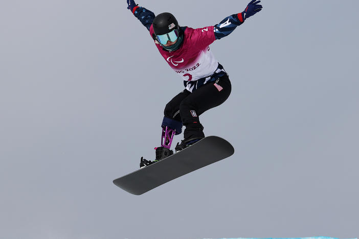 Brenna Huckaby competes during the Women's Snowboard Cross SB-LL2 Qualification during day two of the Beijing 2022 Winter Paralympics on Sunday.