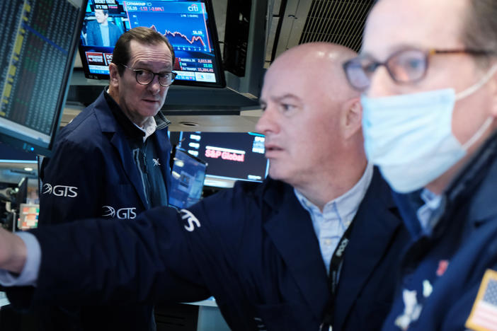Traders work on the floor of the New York Stock Exchange in New York City on March 4. The Dow Jones Industrial Average slumped nearly 800 points on Monday, entering what's called a correction.