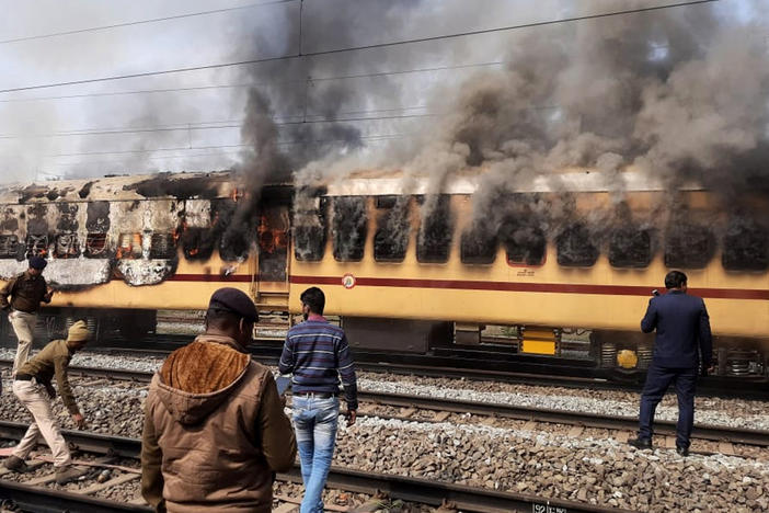 A mob set this train car afire as they protested railway jobs that set increasingly demanding requirements, shutting out many applicants. What the media called a "job riot" took place in Gaya in the northeast Indian state of Bihar on Jan. 26.