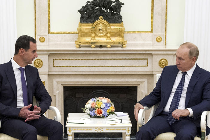 Russian President Vladimir Putin (right) hosts Syrian President Bashar al-Assad during a meeting in the Kremlin in Moscow on Sept. 13, 2021. The U.S. says Russia is recruiting Syrian fighters to help with its war effort in Ukraine.