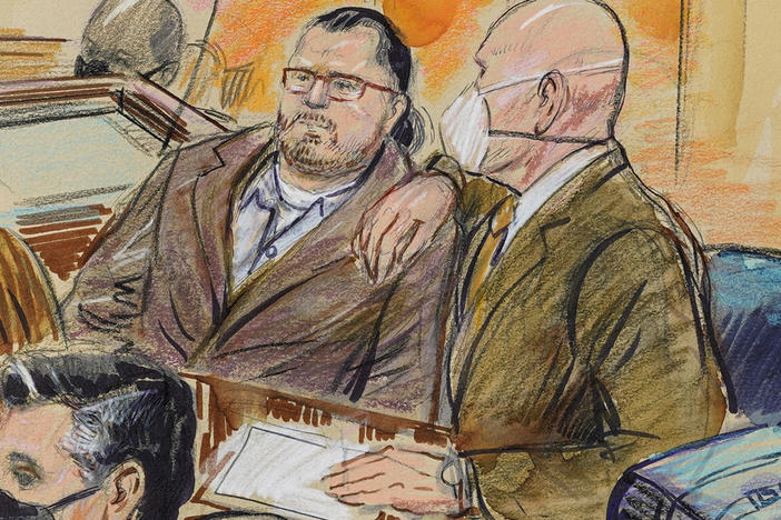 This sketch depicts Guy Wesley Reffitt (left) and his lawyer, William Welch, in federal court in Washington, D.C., on Feb. 28. A jury found Reffitt guilty on all counts for his participation in the Jan. 6, 2021, riot at the U.S. Capitol.
