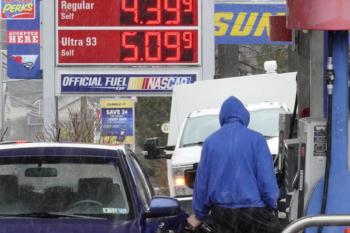 A man pumps gas at a Giant Eagle GetGo in Mount Lebanon, Pa., on Monday.