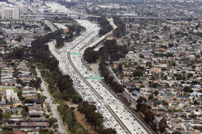 Interstate 405 cuts through neighborhoods near the Los Angeles International Airport, seen here in 2017. A new study found links between modern urban air pollution and historical redlining at the national level.
