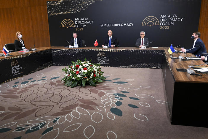 In this photo released by the Russian Foreign Ministry Press Service, Turkish Foreign Minister Mevlut Cavusoglu (center) chairs a tripartite meeting with Russia's Foreign Minister Sergey Lavrov (left) and Ukraine's Foreign Minister Dmytro Kuleba(right) in Antalya, Turkey, on Thursday.