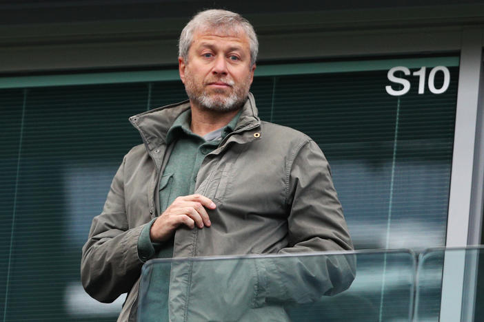 Roman Abramovich, pictured at a 2016 match in London, is facing an asset freeze and U.K. travel ban just a week after he announced plans to sell Chelsea Football Club.