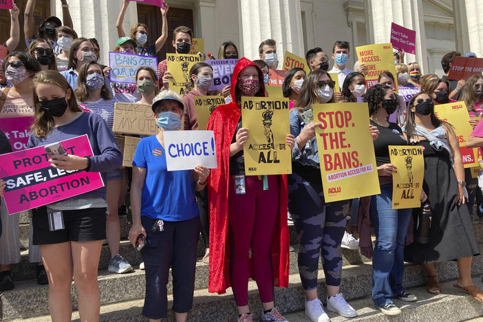 Legal experts say so-called bounty hunter bills, including the Missouri measure that would let people sue anyone they suspect of helping a resident get an abortion in another state, are most certainly unconstitutional, with little chance of withstanding legal challenges. Here, abortion-rights activists gathered to protest Republican-led restrictions in St. Louis last September.