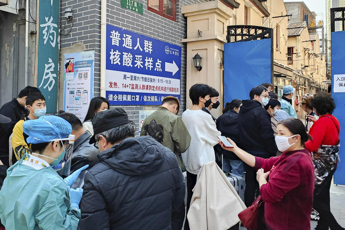 People line up for coronavirus tests outside a hospital in Shanghai on Friday.