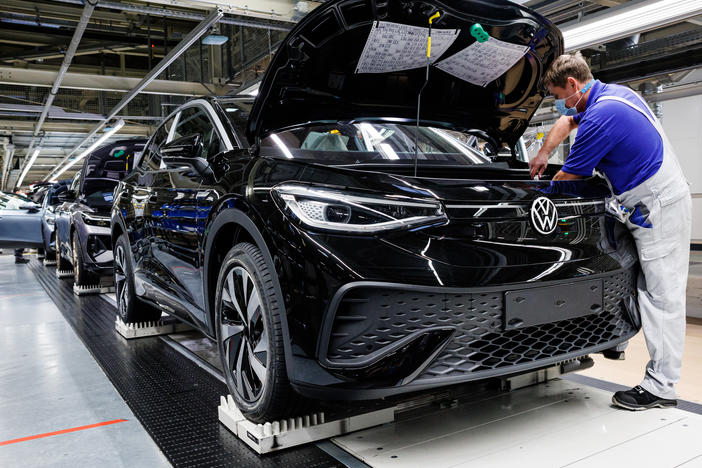 A worker assembles Volkswagen electric cars at the company's plant in Zwickau, Germany on Jan. 27. Automakers like Volkswagen are racing to secure enough metals to power the batteries needed to make electric vehicles.