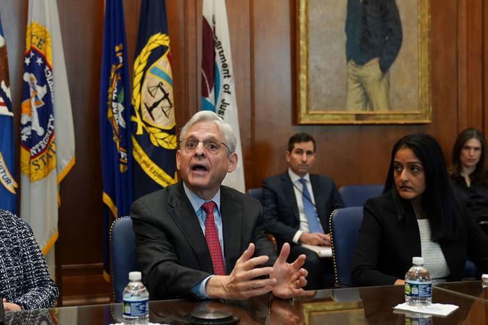 Flanked by US Deputy Attorney General Lisa Monaco (L) and Associate Attorney General Vanita Gupta, Attorney General Merrick Garland convenes a Justice Department component heads meeting at the Justice Department on March 10. Garland was prompted by an NPR story on compassionate release waivers to fix the issue.
