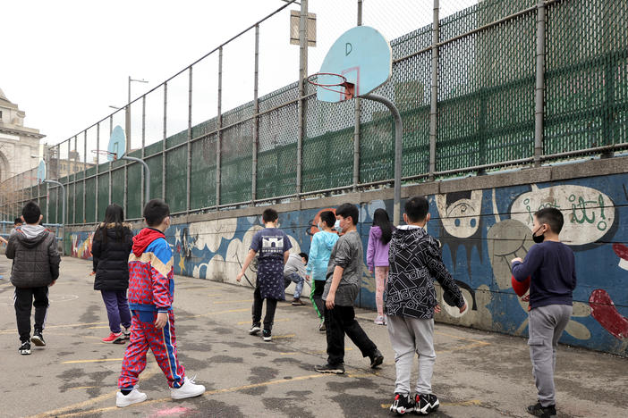 Students play at recess on an outdoor court at Yung Wing School P.S. 124 on March 7, 2022, in New York City.