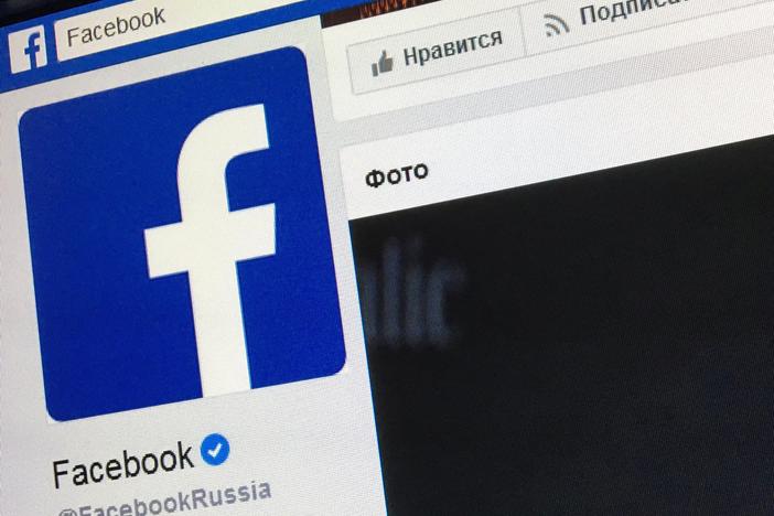 A picture taken in Moscow in March 2018 shows the Russian language version of Facebook's "about" page, featuring the face of founder and CEO Mark Zuckerberg.